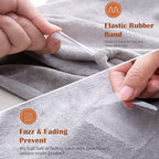 Close-up of a grey microfiber hair towel showing an elastic band and a smooth texture that prevents fuzz and fading.