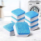 Several blue and white washing machine cleaner tablets stacked on a textured surface, with a washing machine in the