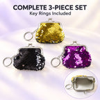 A set of three sequined coin purse keychains in gold, black, and purple, displayed on a soft, glowing surface.