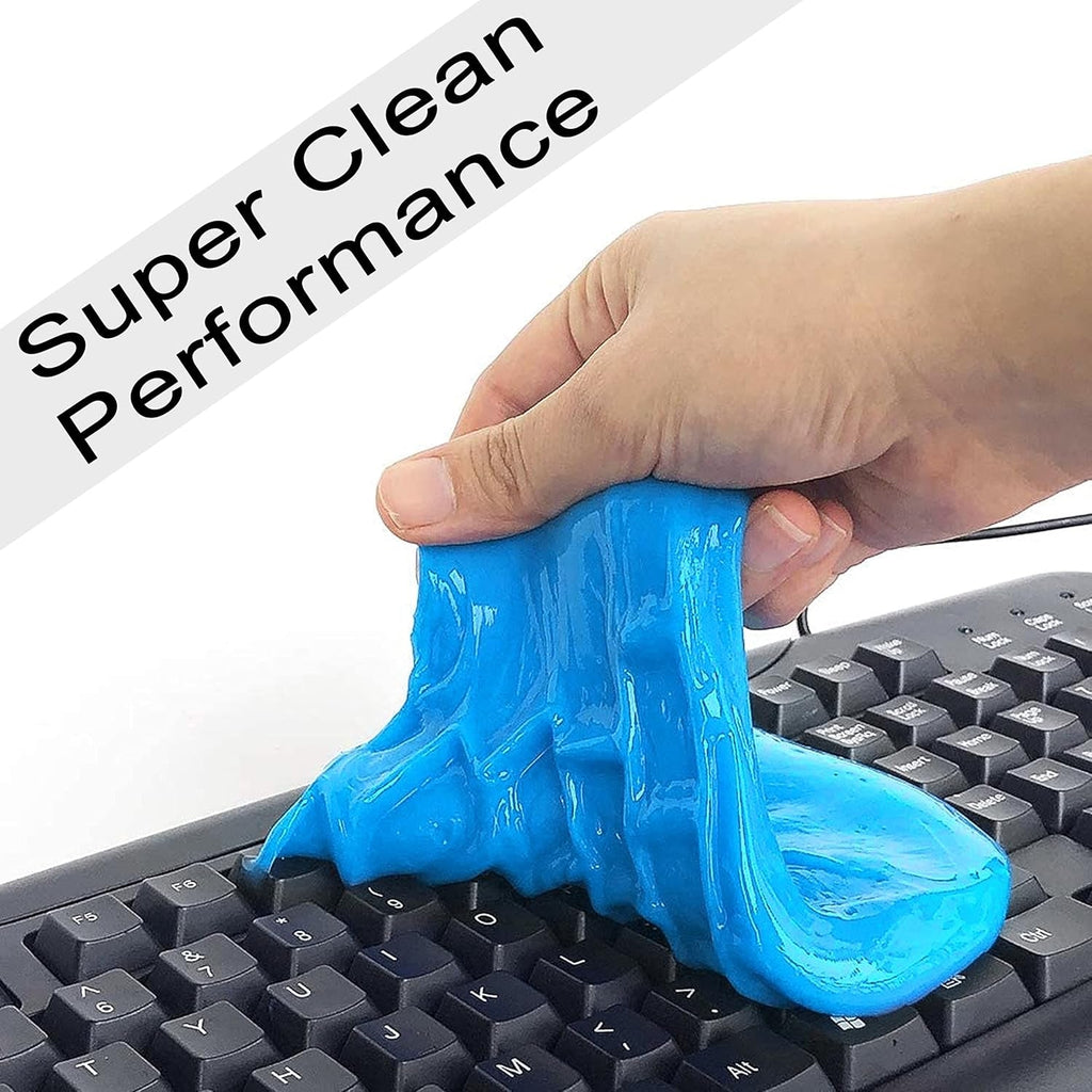 A hand stretches blue cleaning gel across the keys of a black computer keyboard.