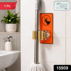 An orange deer-themed wall-mounted holder on a white tiled wall, holding a mop, with a small inset showing product