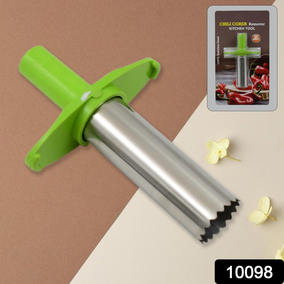 A green and silver chili corer is displayed on a two-tone brown and beige background with its retail packaging.