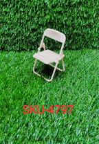 Adjustable miniature foldable chair phone stand compatible with a wide range of smartphone models.
