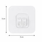 A single clear square adhesive hook with twin prongs, showing its dimensions of 5 cm by 5 cm on a white background.