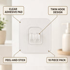 A clear adhesive hook with twin prongs is shown with text labels pointing to its features: clear pad, twin hook,