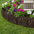 Plastic decorative garden fence border installed around flowers