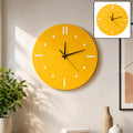 A bright yellow round wall clock with white hour markers and black hands hangs on a light wall. A smaller inset shows a