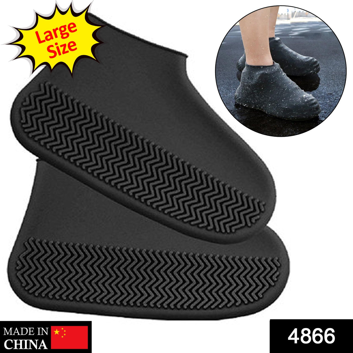 A person's legs and feet, wearing black silicone shoe covers, stand on a wet wooden deck.