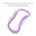 A lavender pilates ring with textured bumps, highlighting its ergonomic double arc design for relief.