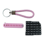 A pink braided wrist loop keychain, a pink number tag, and a sheet of number stickers on a white background.