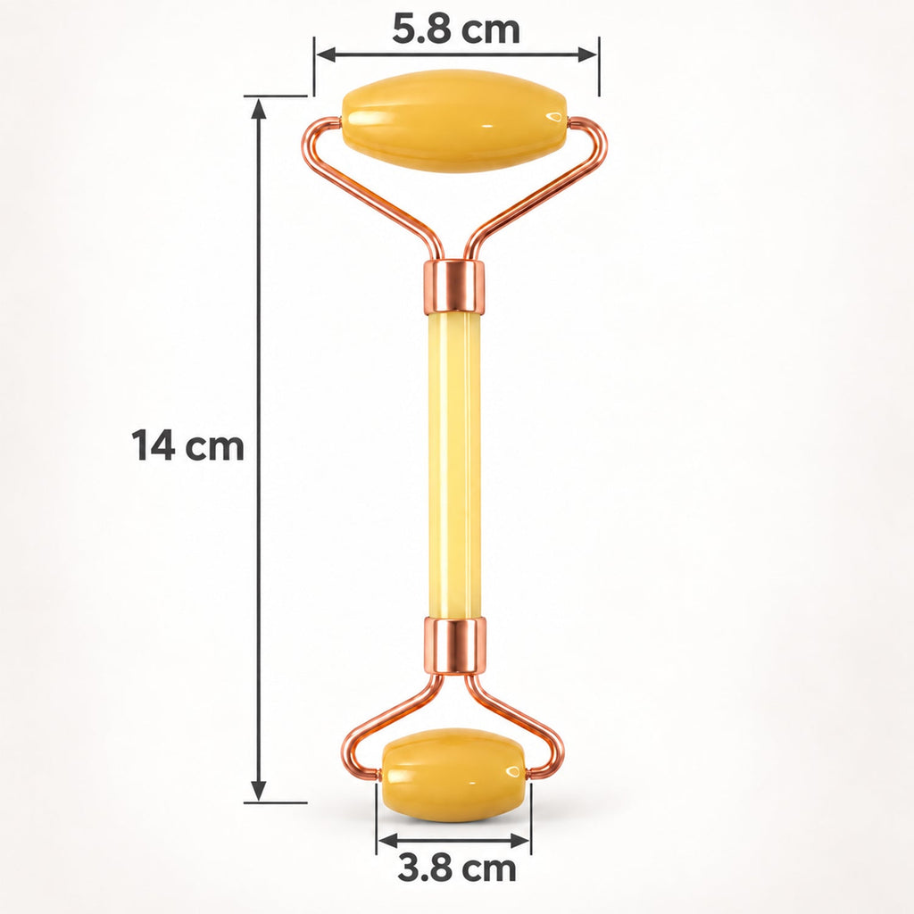 A yellow jade facial roller with rose gold frame is displayed with its dimensions of 14 cm length and roller widths of 5.8