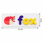 A white word puzzle card with a red fox illustration and the word “fox” spelled out in purple and yellow letters, with