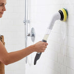 Cleaning brush scrubbing bathroom wall tiles