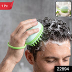 A man shampoos his hair with a light green silicone scalp massage brush, creating white suds, with a small inset showing the