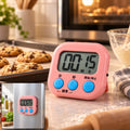Digital kitchen timer with clear LCD display and white casing