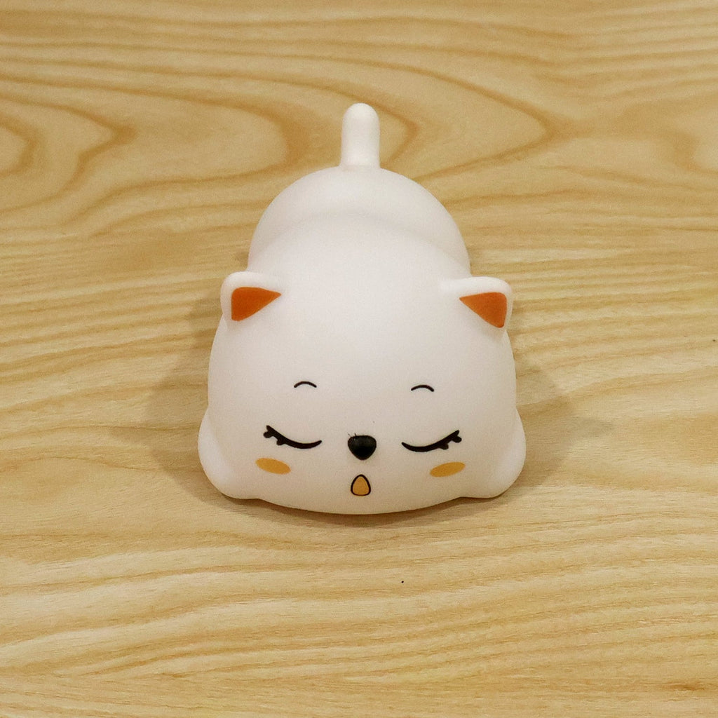 Sleeping cat night light used in a bedroom setting