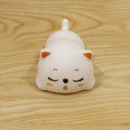 Sleeping cat night light used in a bedroom setting