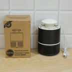 Black and white mosquito killer lamp next to its brown cardboard packaging on a wooden surface.