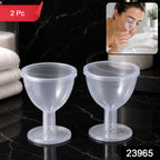 Two clear plastic eye wash cups on a dark marble counter, with a small inset showing a woman using one. The image has a red