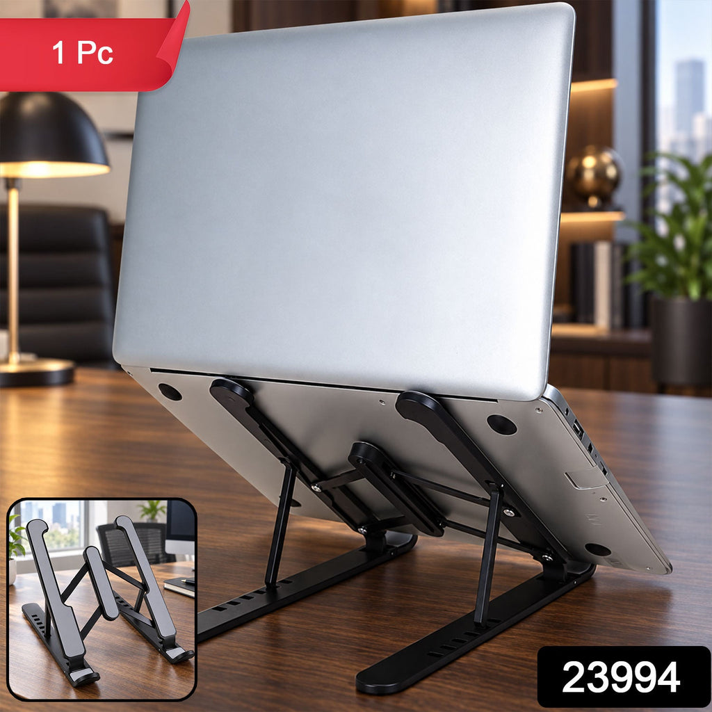 A silver laptop sits on a black adjustable stand, angled upwards on a wooden desk, with an inset showing the stand folded.