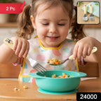 A young girl in a bib holds a panda-handled fork and spoon, eating pasta from a teal bowl, with a "2 Pc" label.