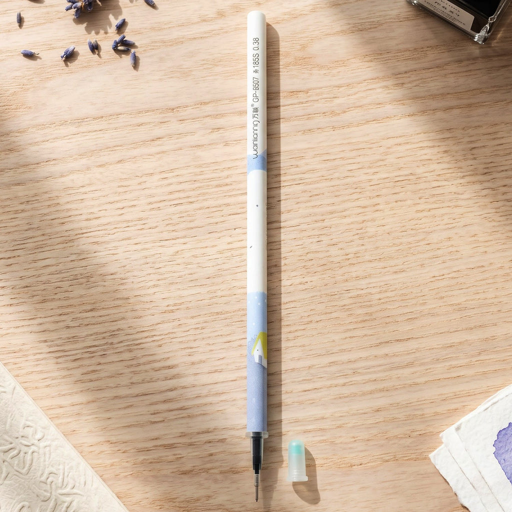 A white and blue pen refill with a small light blue cap on a wooden desk, surrounded by dried lavender.