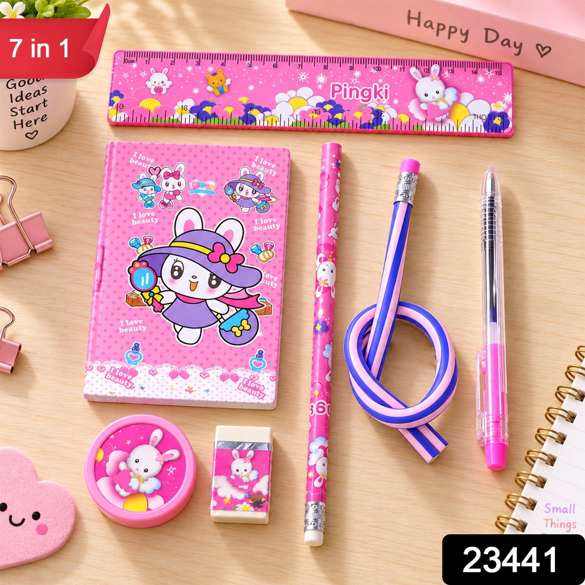 A pink rabbit-themed stationery set on a wooden table, including a ruler, notebook, two pencils, a pen, a – view 2