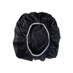 Black backpack rain cover with an elastic opening, laid flat on a white background.