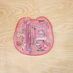 A pink rabbit-themed stationery set in clear plastic packaging, featuring a ruler, two pencils, a notebook, a pen, a