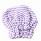 A purple and white chevron microfiber hair towel with a grey bow, laid flat on a white background.