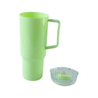 A light green plastic travel tumbler with a handle is shown next to its clear lid on a white background.