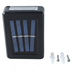 A black solar LED wall light with a blue solar panel is shown with two white wall plugs and two silver screws on a white