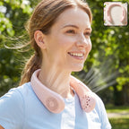 A smiling woman wears a pink portable neck fan outdoors, with a small inset showing the fan.