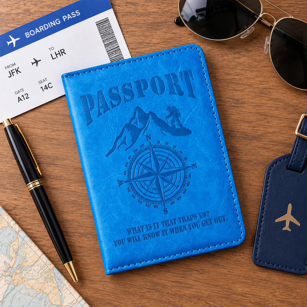 Closed blue passport holder on a wooden table with a boarding pass, pen, and sunglasses nearby.