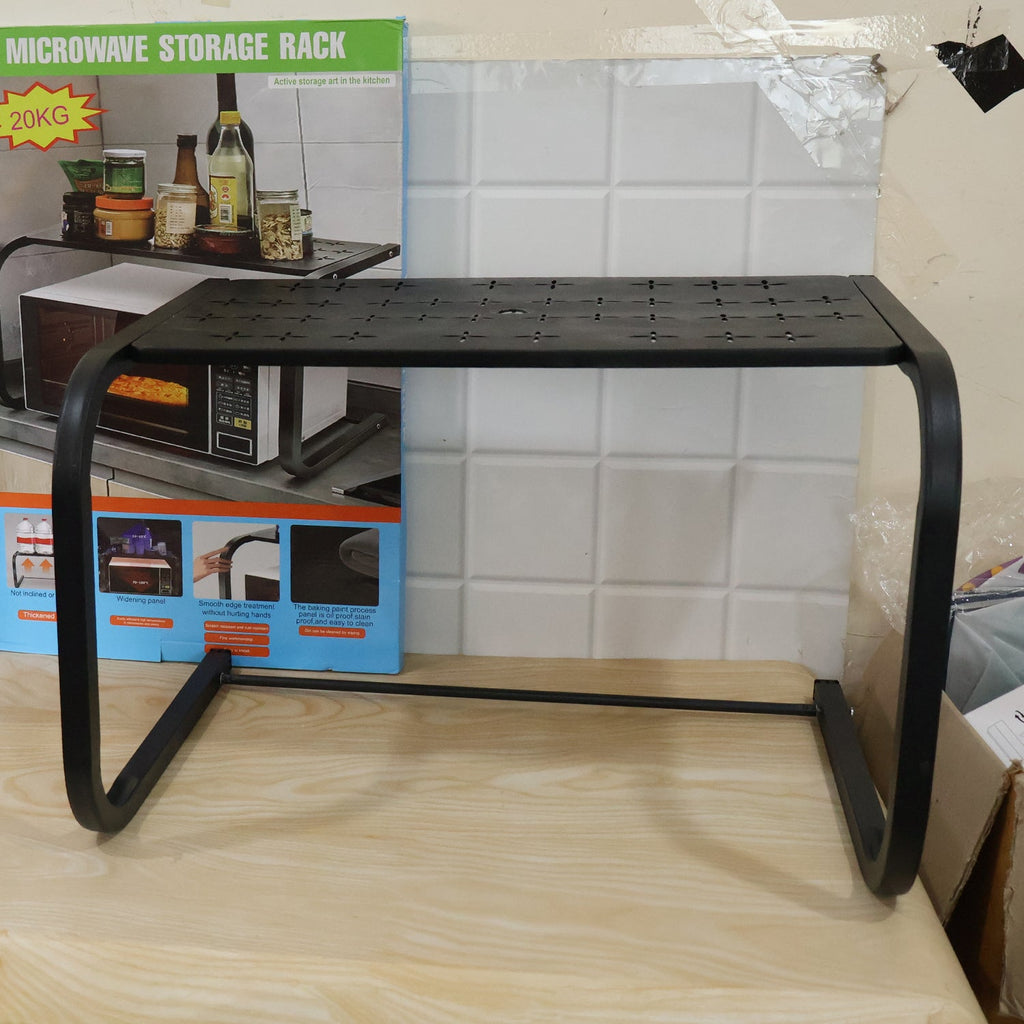 Live photo of metal microwave oven storage rack