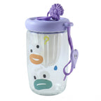 A clear glass tea sipper cup with a purple lid, infuser, and cartoon duck face design is shown on a white background.