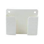 A white plastic wall-mounted phone holder with two compartments and two screw holes, viewed head-on.