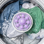 Purple and white floating lint catcher mesh bag for washing machine
