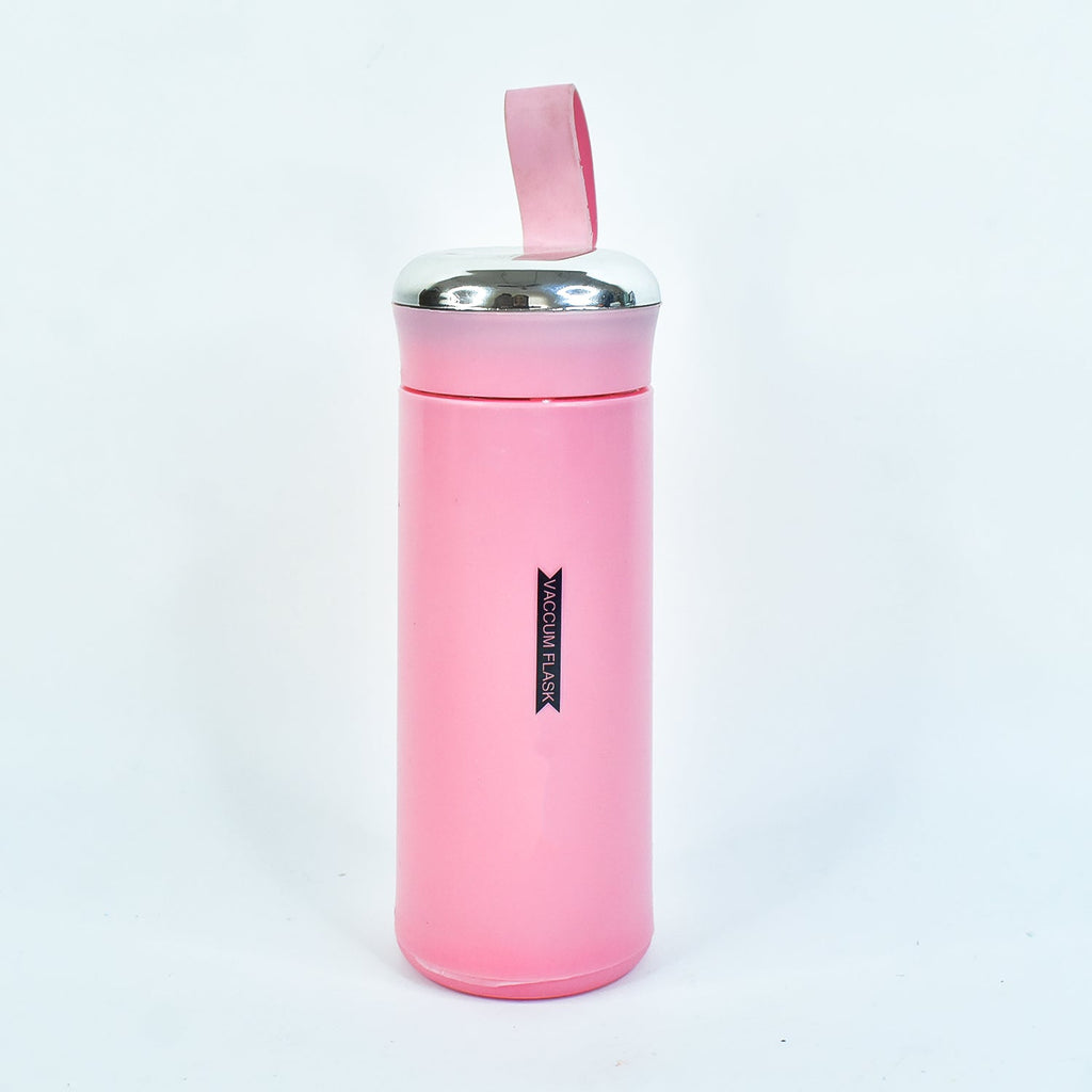 A pink vacuum flask with a silver lid and strap stands upright on a plain white background.