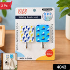Packaged adhesive hooks with dolphin and sailboat patterns, featuring a small inset image of them in use.