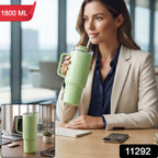 A woman in an office setting sips from a light green travel tumbler with a handle and straw, with an inset showing the