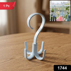 A light blue plastic rotating multi-hook hanger sits on a wooden table, with a red "1 Pc" label and an inset showing it
