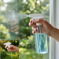A hand holds a clear spray bottle with blue liquid, spraying water onto a windowpane, with an inset of the sprayer